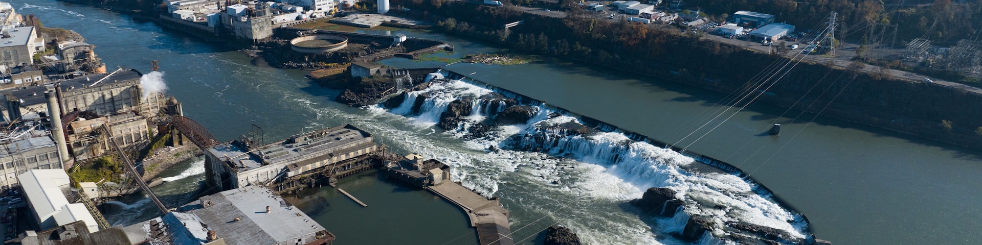 The Willamette Falls is a natural waterfall between West Linn and Oregon City, not far south of Portland, Oregon. By volume, this is the largest waterfall in the Northwestern United States.
