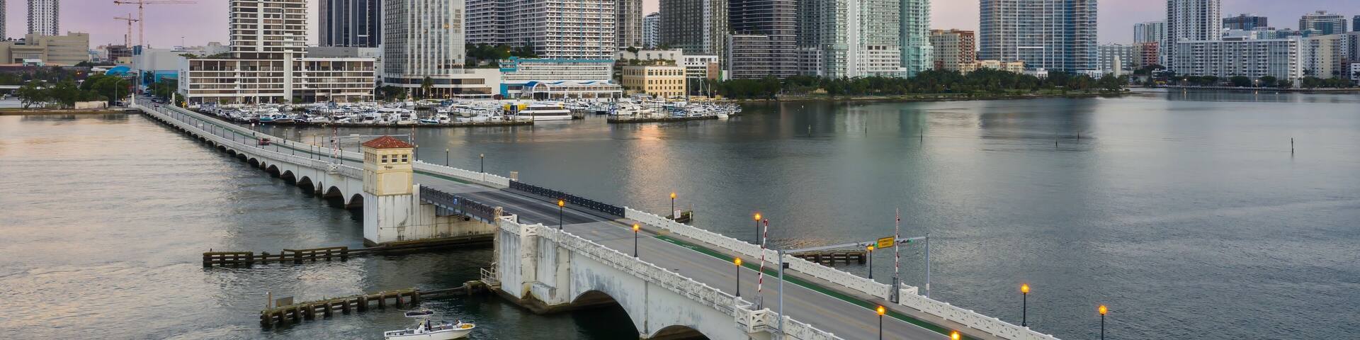 Downtown waterfront buildings and the West Venetian Causeway Bridge over the Biscayne bay, Miami, Florida, United States.