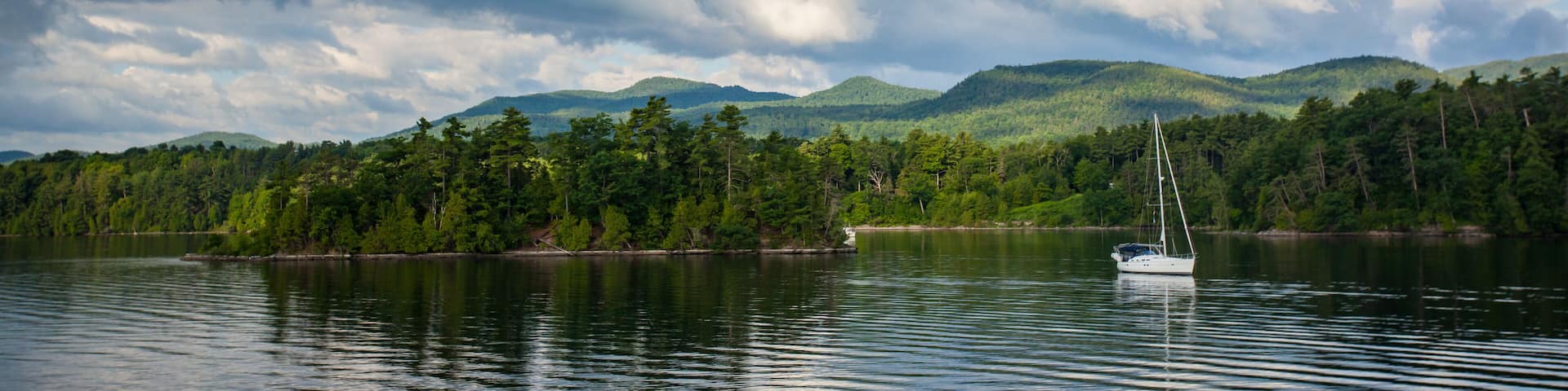Sailboat moored near Cole Island on a summer day on Lake Champlain