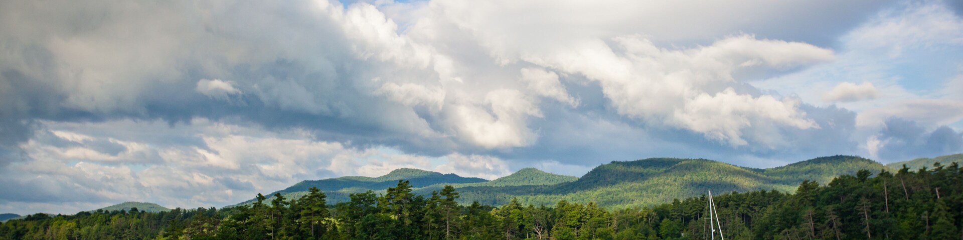Sailboat moored near Cole Island on a summer day on Lake Champlain