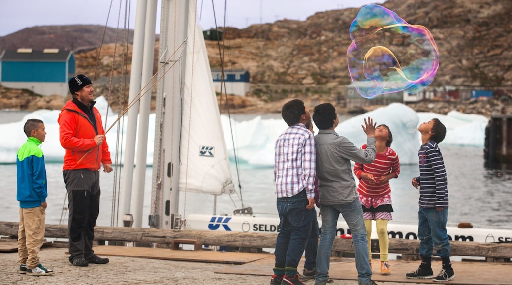 Upernavik which includes a bay or harbour as well as children