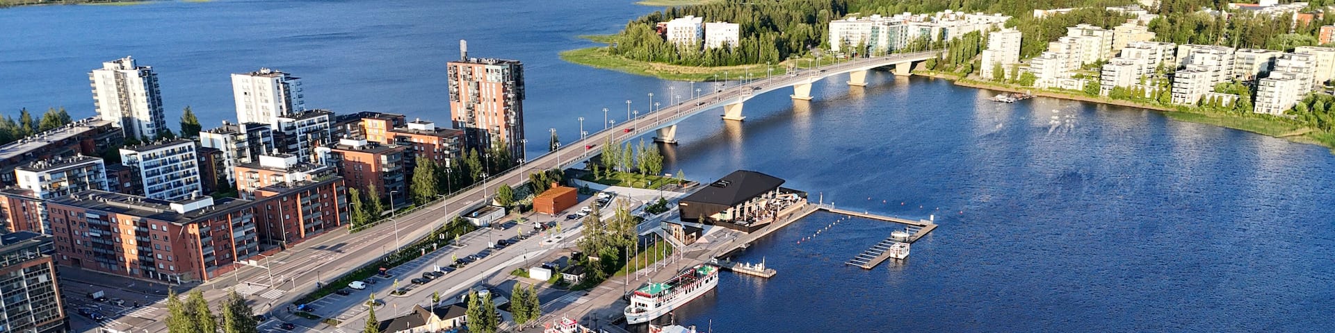 Golden Hour Drone View of Kuokkalan Silta and Jyväskylä Harbor in Summer Evening