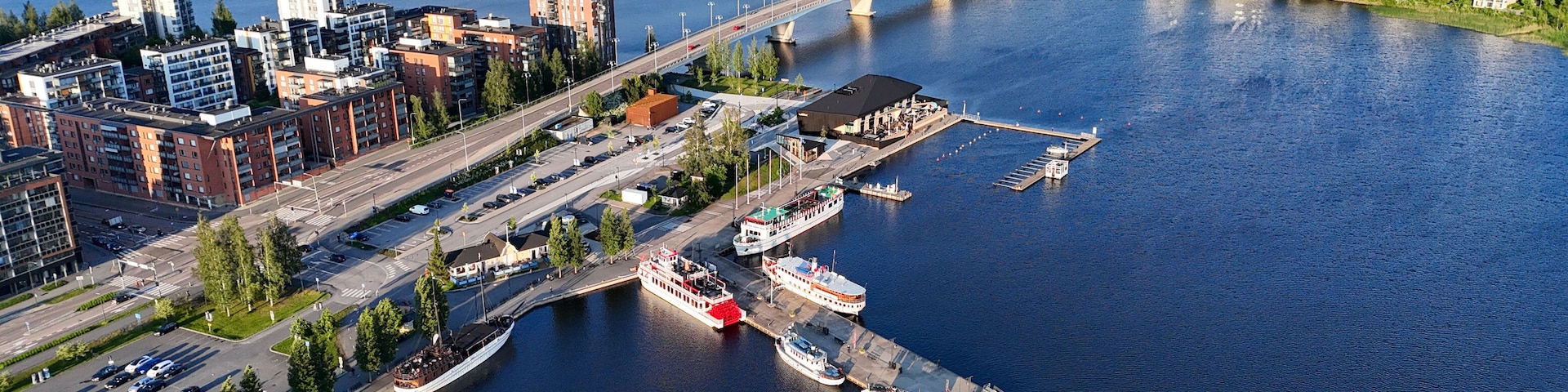 Golden Hour Drone View of Kuokkalan Silta and Jyväskylä Harbor in Summer Evening