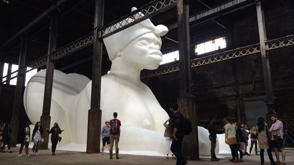 Kara Walker's 35ft sphinx-like sculpture made of 4 tons of sugar.
http://mobile.nytimes.com/2014/05/12/arts/design/a-subtlety-or-the-marvelous-sugar-baby-at-the-domino-plant.html?_r=0&referrer=