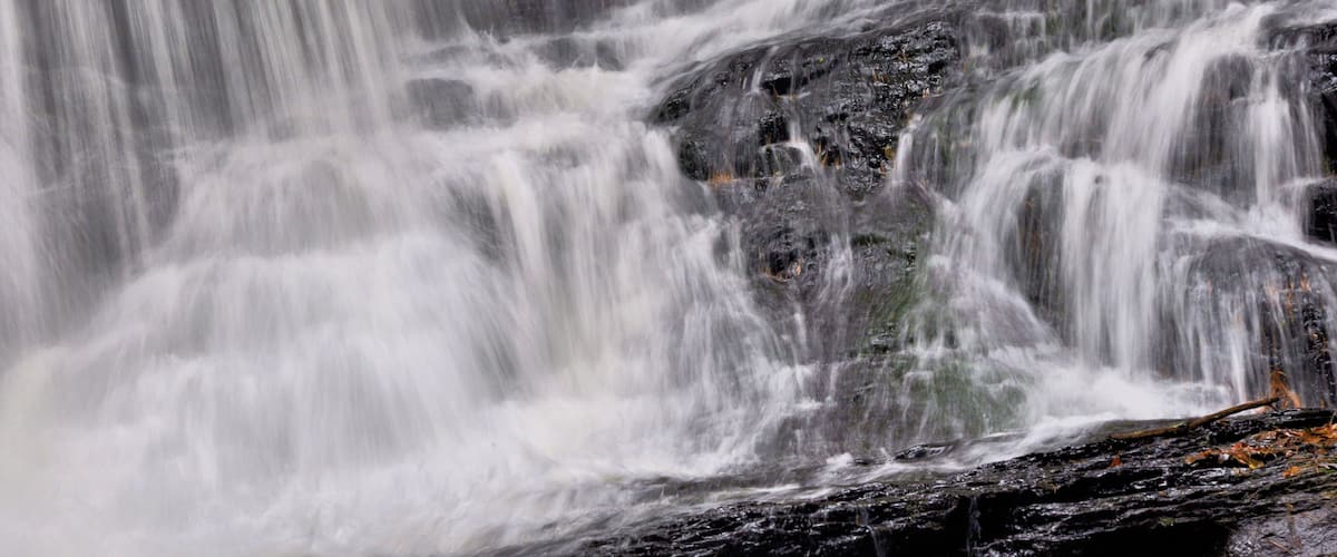 A waterfall cascading over rocks.