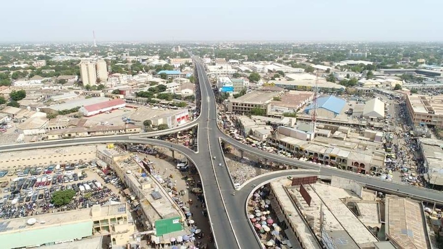 Chief Olusegun Obasanjo Flyover is the longest flyover in West Africa and one of the longest if not the longest in Africa as a whole.
The fly-over located at the Central Business Area of Sabon Gari,  Kano - an urban setting that has mostly non-indigenes as its habitat is pretty a fantastic destination for mild adventure. A place located in Northern Nigeria and populated mostly by the Muslims. 
The said flyover has different route that provide assessable road channels that does not just make road links possible but lessen road congestion and foster quick arrival to one's destination. 
The hustling and bustling nature of the scene, the varieties of goods and food items sold, the manner, language (Hausa) and way of life of the people, the common and most consumed diet, are all worth the experience.
#Culture.
