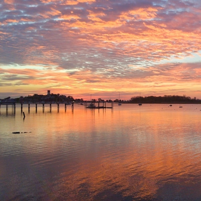 Shot at sunrise from the Cottage Park Yacht Club parking lot towards the Winthrop Water tower.