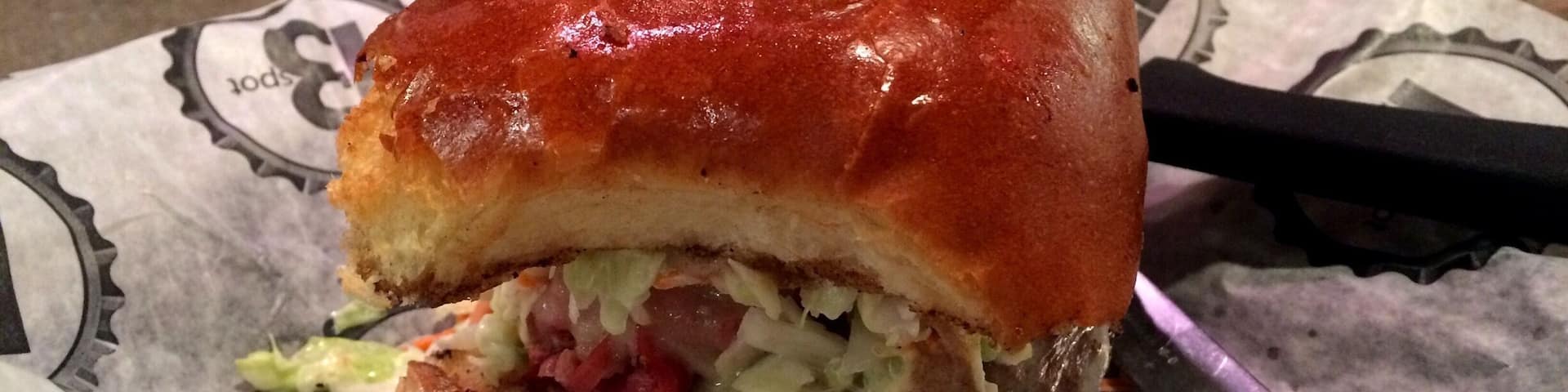 Mouthwatering burgers can be found at this local dive, B Spot. Try the Fat Doug and wash it down with a Great Lakes Lager. The burger patty is tender, topped with coleslaw and pastrami and surprisingly is not filling at all. #Delicious