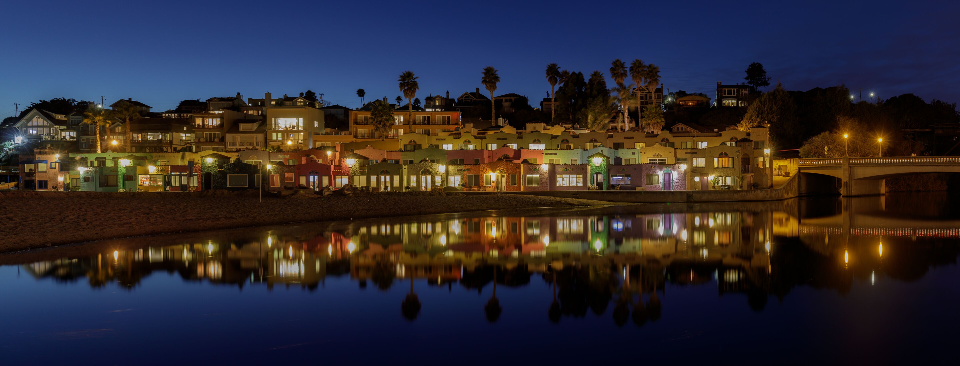 Panoramic Capitola Village and Water Reflections during Blue Hour. Capitola, Santa Cruz County, California, USA.