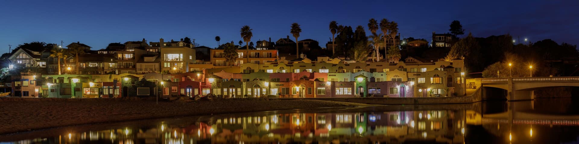 Panoramic Capitola Village and Water Reflections during Blue Hour. Capitola, Santa Cruz County, California, USA.