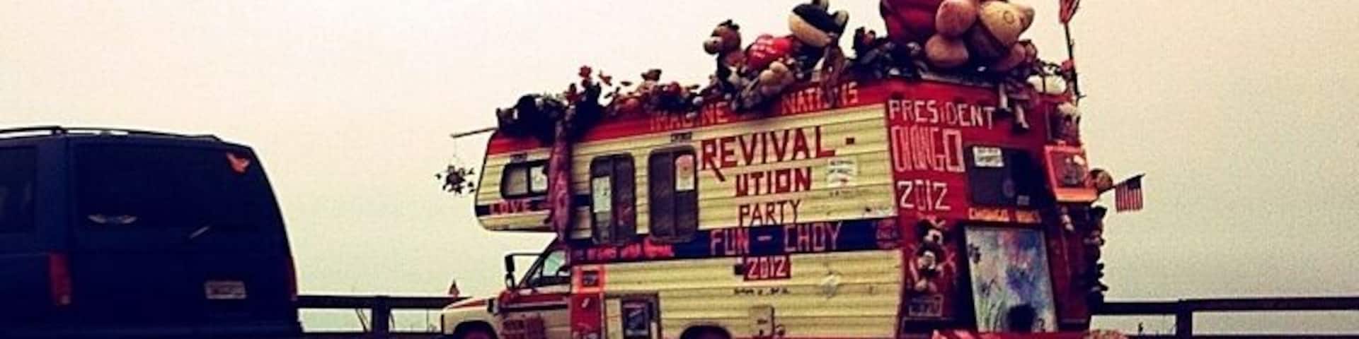 Two awesome things to point out in this photo: the crazy camper in front with all the stuffed animals and things on it, and the Lamborghini behind me.