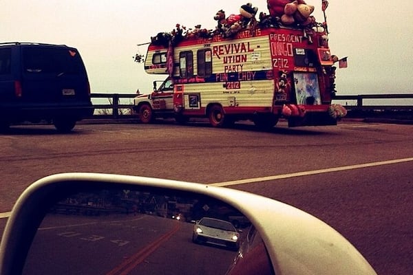 Two awesome things to point out in this photo: the crazy camper in front with all the stuffed animals and things on it, and the Lamborghini behind me.