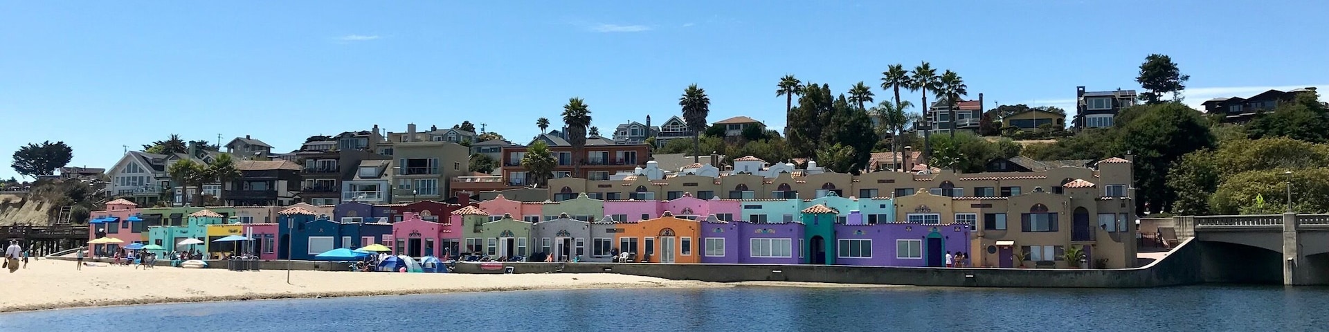 The colorful Capitola Venetian Hotel sits alongside the Pacific Ocean at the end of Capitola Beach.