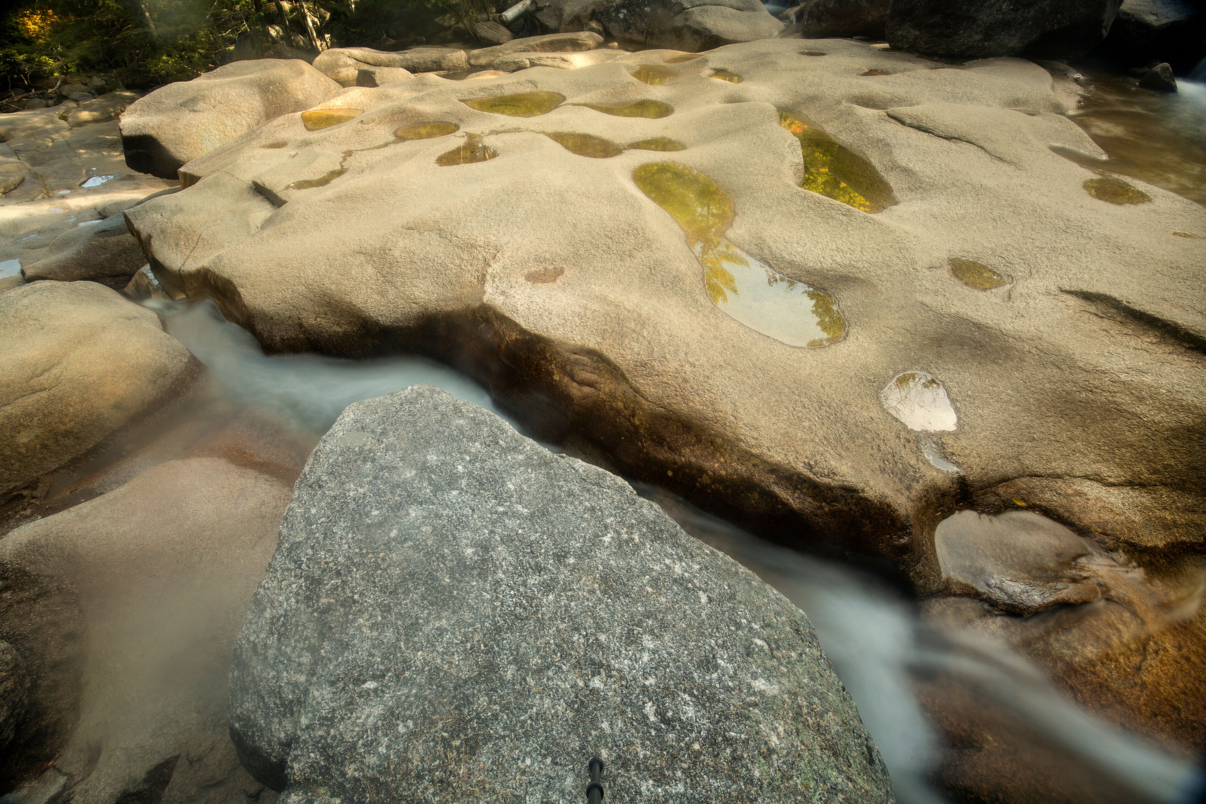 Potholes in granite bedrock of Diana's Baths, Bartlett, New Hampshire.