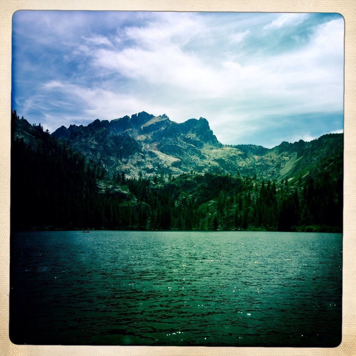 Cool Hipstamatic shot of the Sierra Buttes from the dock at the Sardine Lake Resort. 