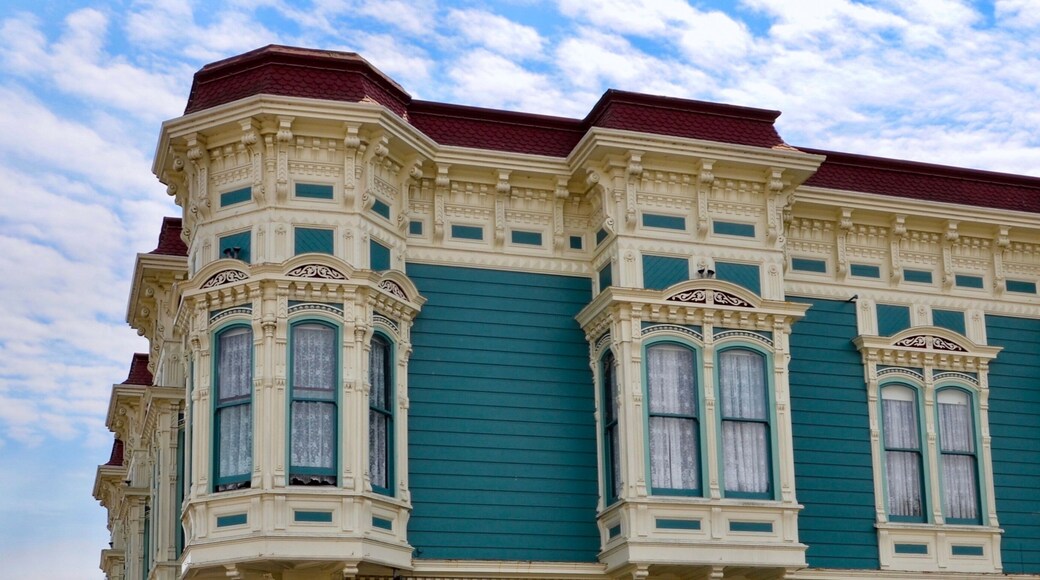 Closeup of traditional house in the city of Ferndale in Humboldt County, California, USA, famous for its Victorian architecture, a sunny day with blue sky and clouds in summer, space for text