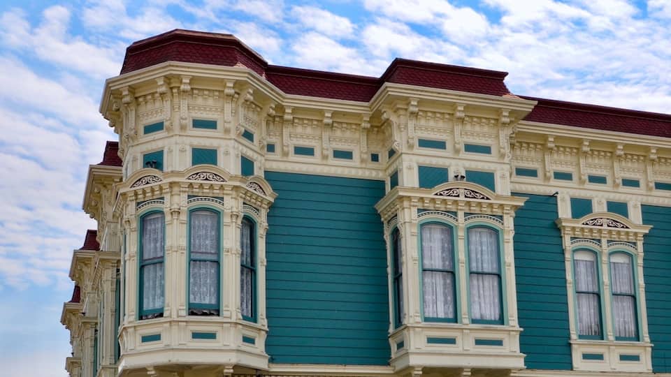A Victorian-style building with ornate detailing and bay windows.