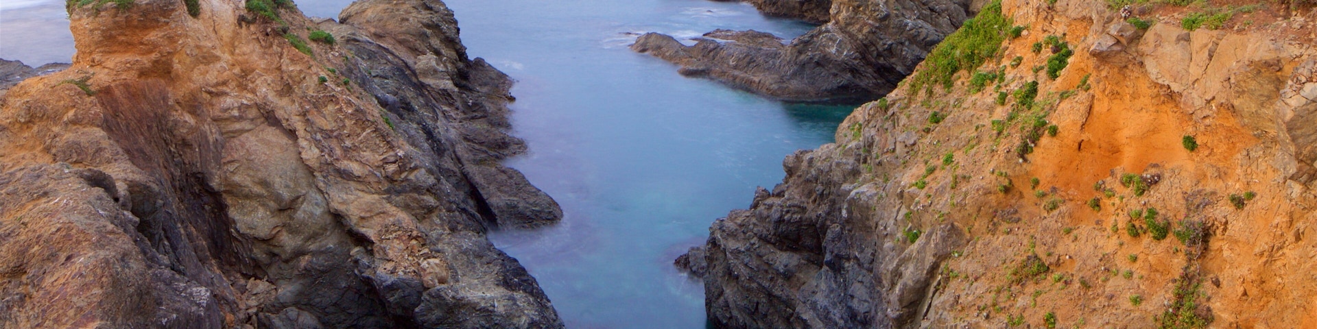 Mendocino featuring general coastal views, a sunset and rugged coastline