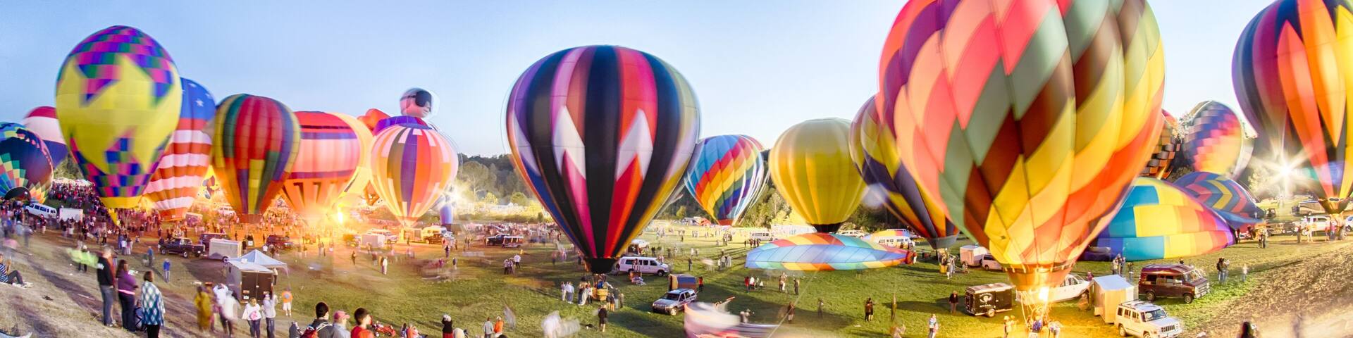 Bright Hot Air Balloons Glowing at Night