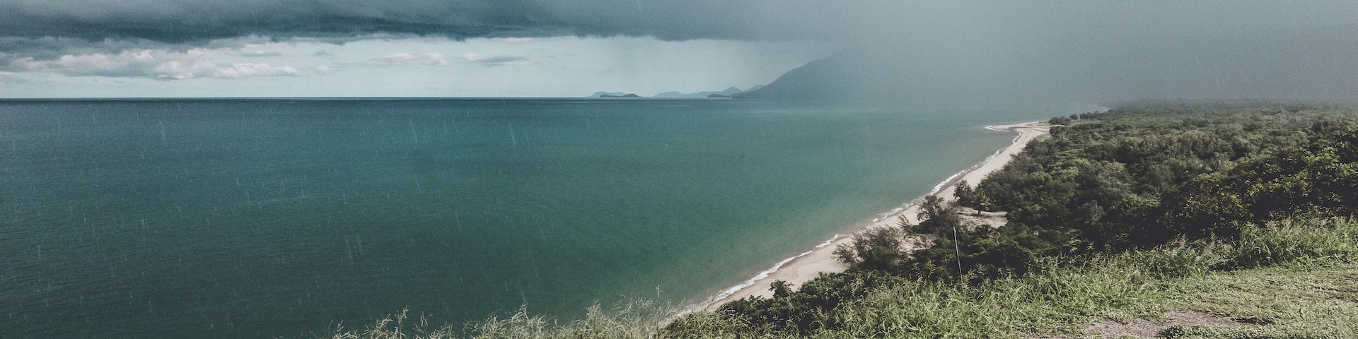 The road from palm Cove to Port Douglas is about as close as you can get to the ocean without driving on the sand. Enjoy the view but drive carefully as you wind through the bends in the road (also don't swim...croc are about!). This was taken in January - the tropical rains come and go every few minutes.