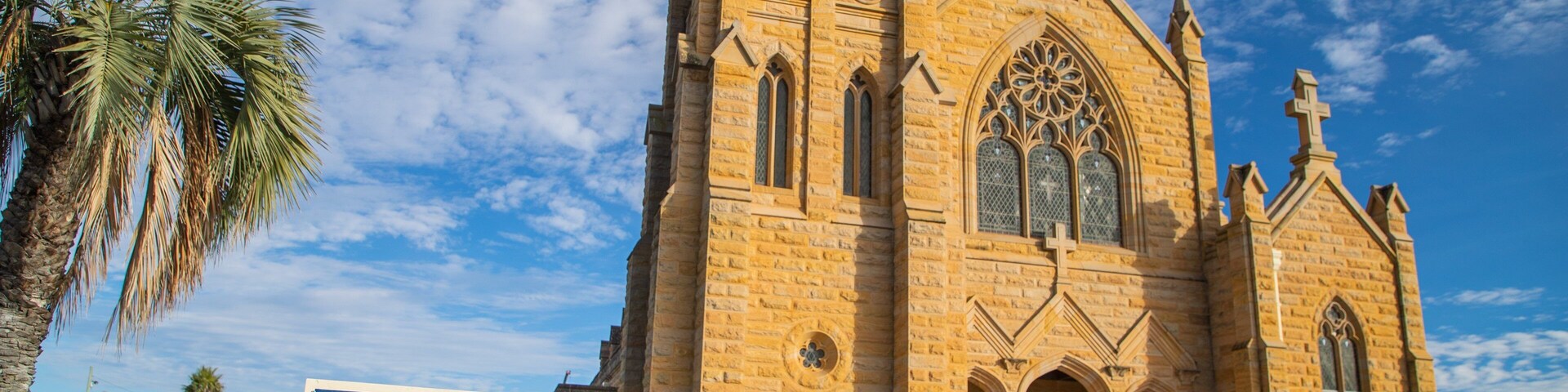 Warwick showing signage, a church or cathedral and heritage architecture