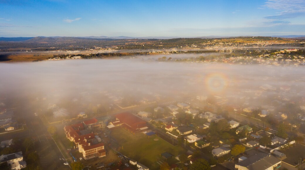 Warwick which includes mist or fog, tranquil scenes and a small town or village