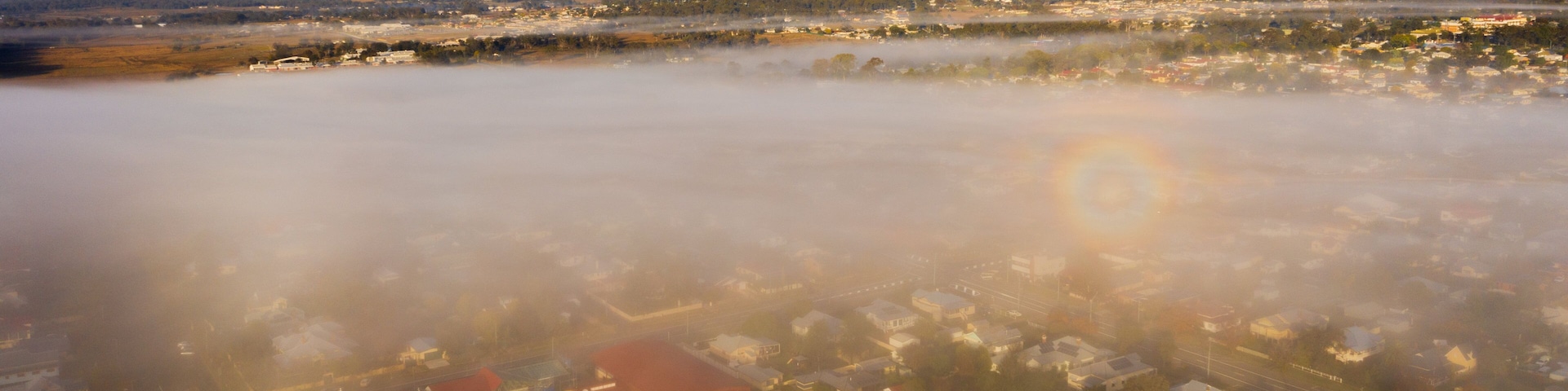 Warwick which includes mist or fog, tranquil scenes and a small town or village