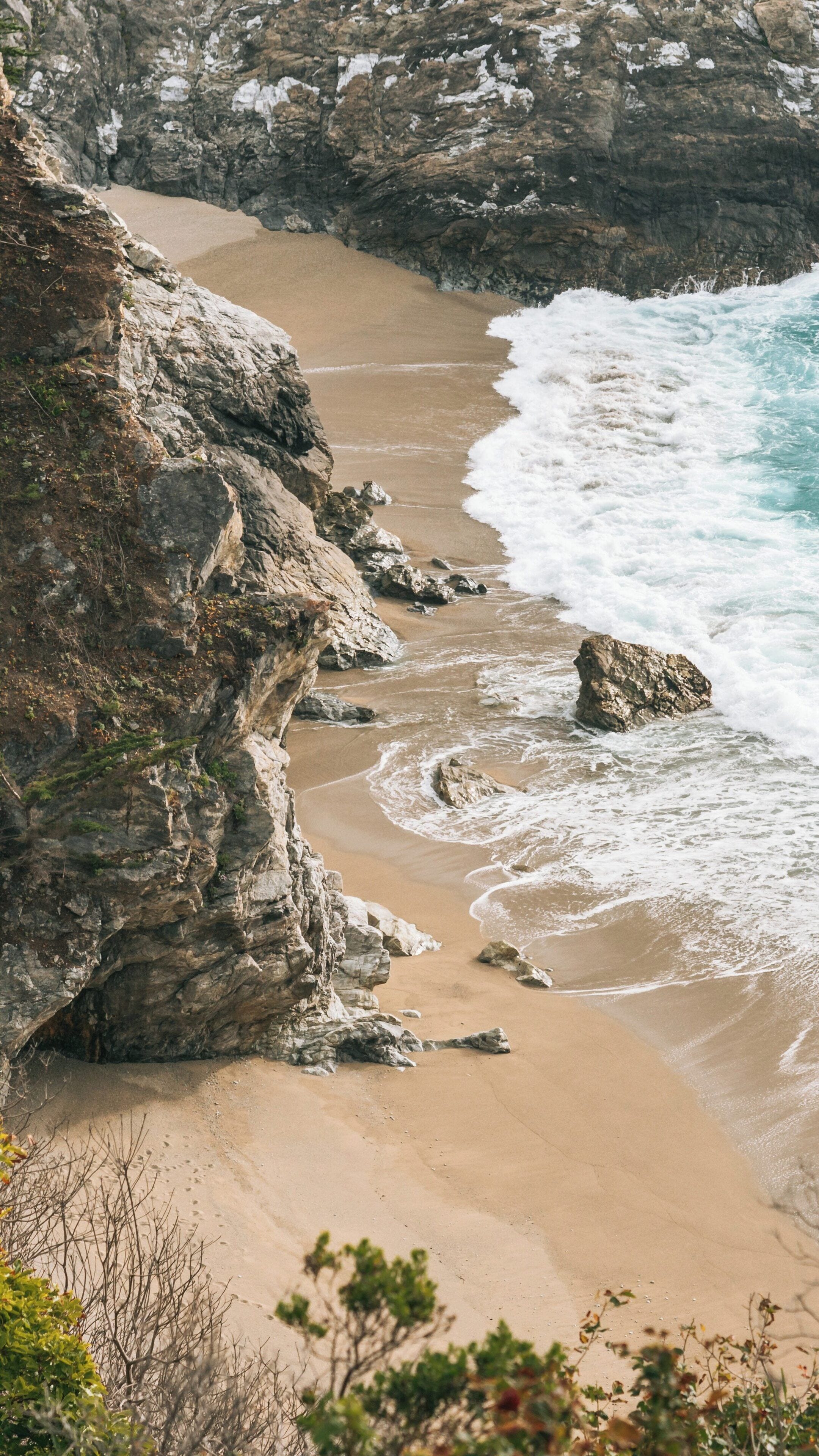 Experience the natural beauty of McWay Falls and its stunning coastal views in Big Sur, California, USA during a tranquil afternoon