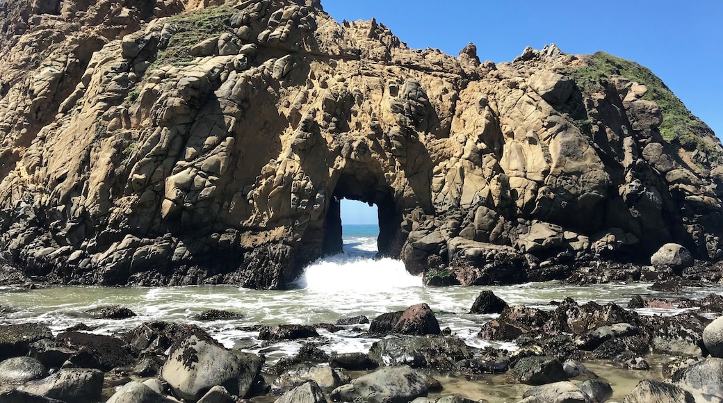 The Doorway Arch at Pfeiffer Beach in Big Sur. Warm sunshine, dark purple sand, and a few sea lions makes for a beautiful day at the beach.