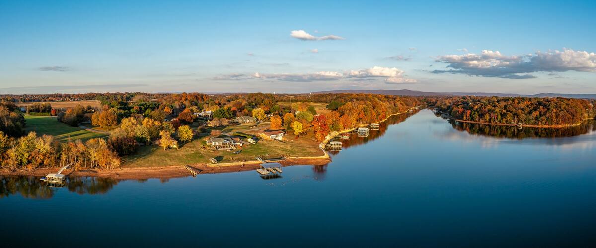 High resolution aerial view panorama of lakefront homes, boat docks and beautiful autumn colorful foliage on Tims Ford Lake in Winchester Tennessee USA.