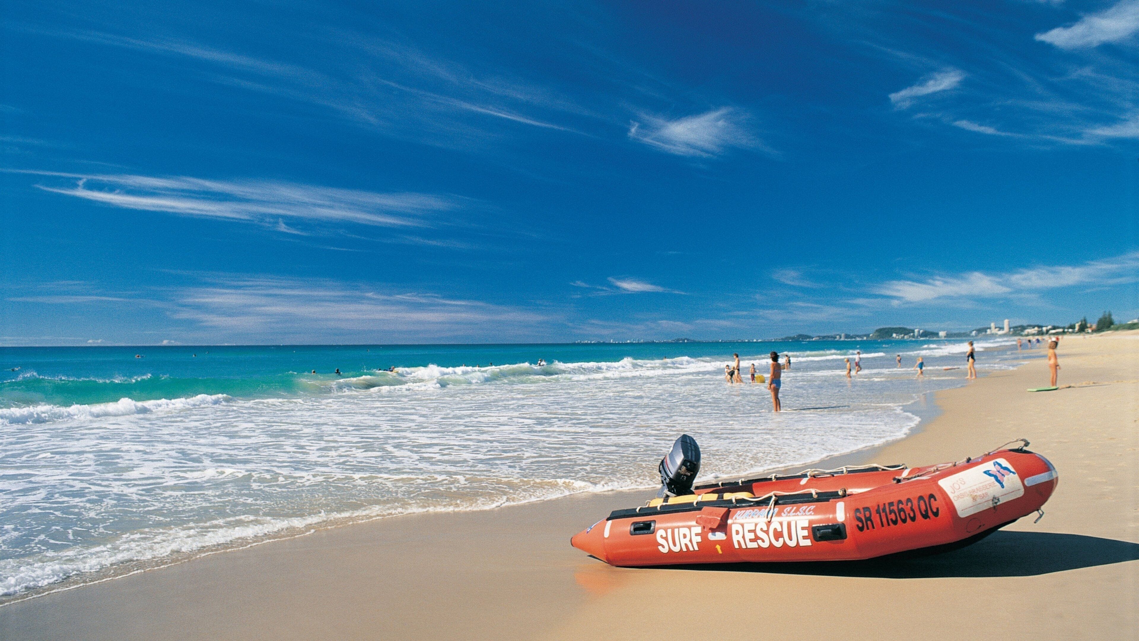 Broadbeach which includes general coastal views and a sandy beach