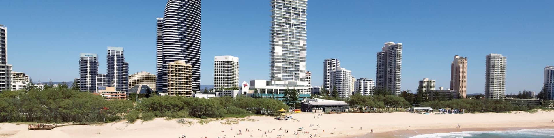 Broadbeach featuring skyline, a sandy beach and a high-rise building