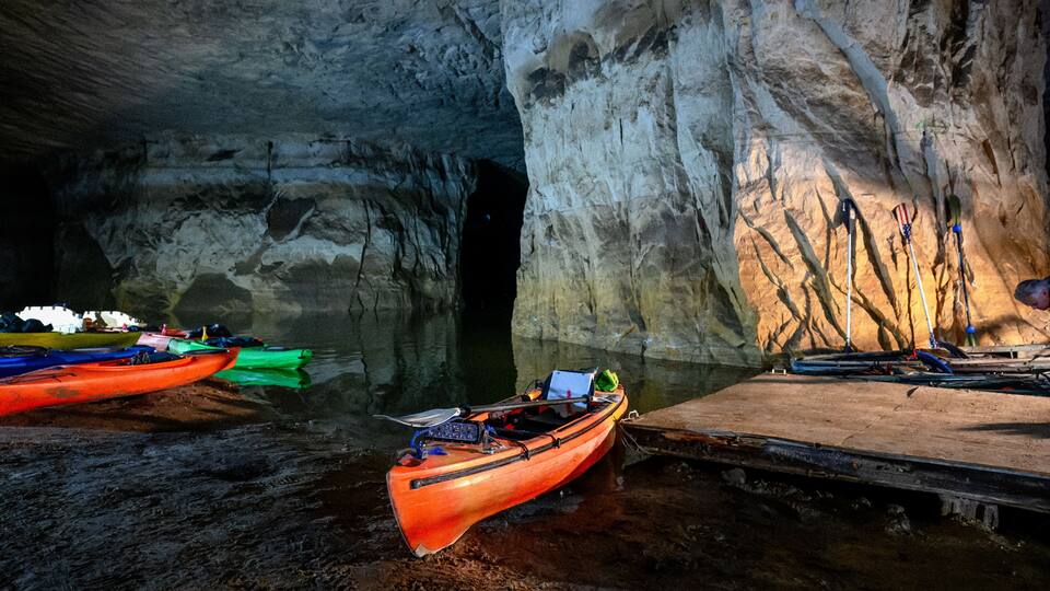 Kayaks lined up at an abandoned underground silica mine that is flooded with water at Crystal City, Missouri.