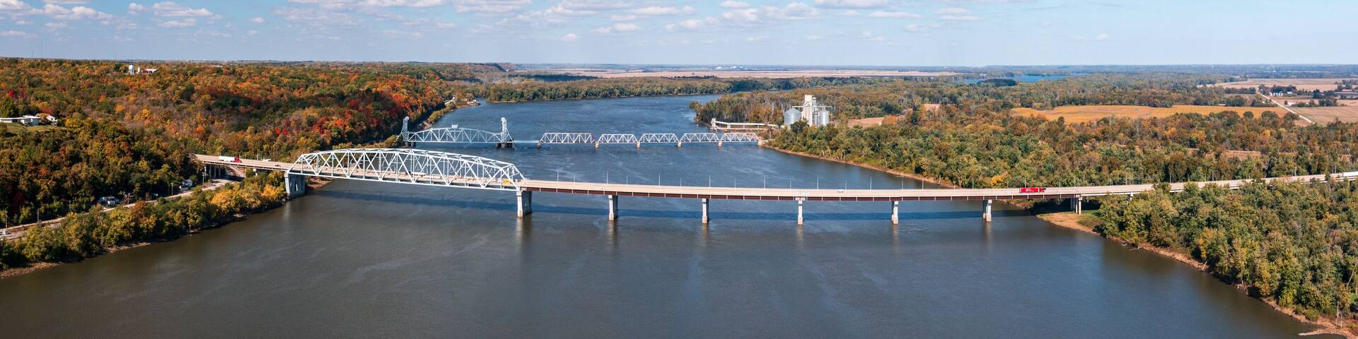 Aerial view of the Mark Twain Memorial highway river bridge and Wabasha railroad bridge between Hannibal Missouri and Illinois
