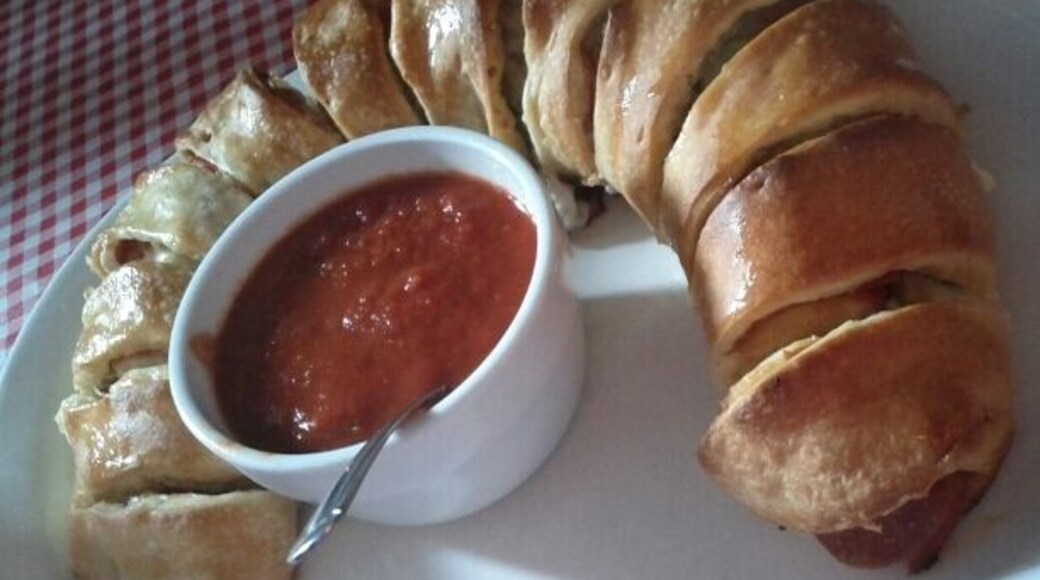 Stromboli with pepperoni, sausage, provolone and green olives.