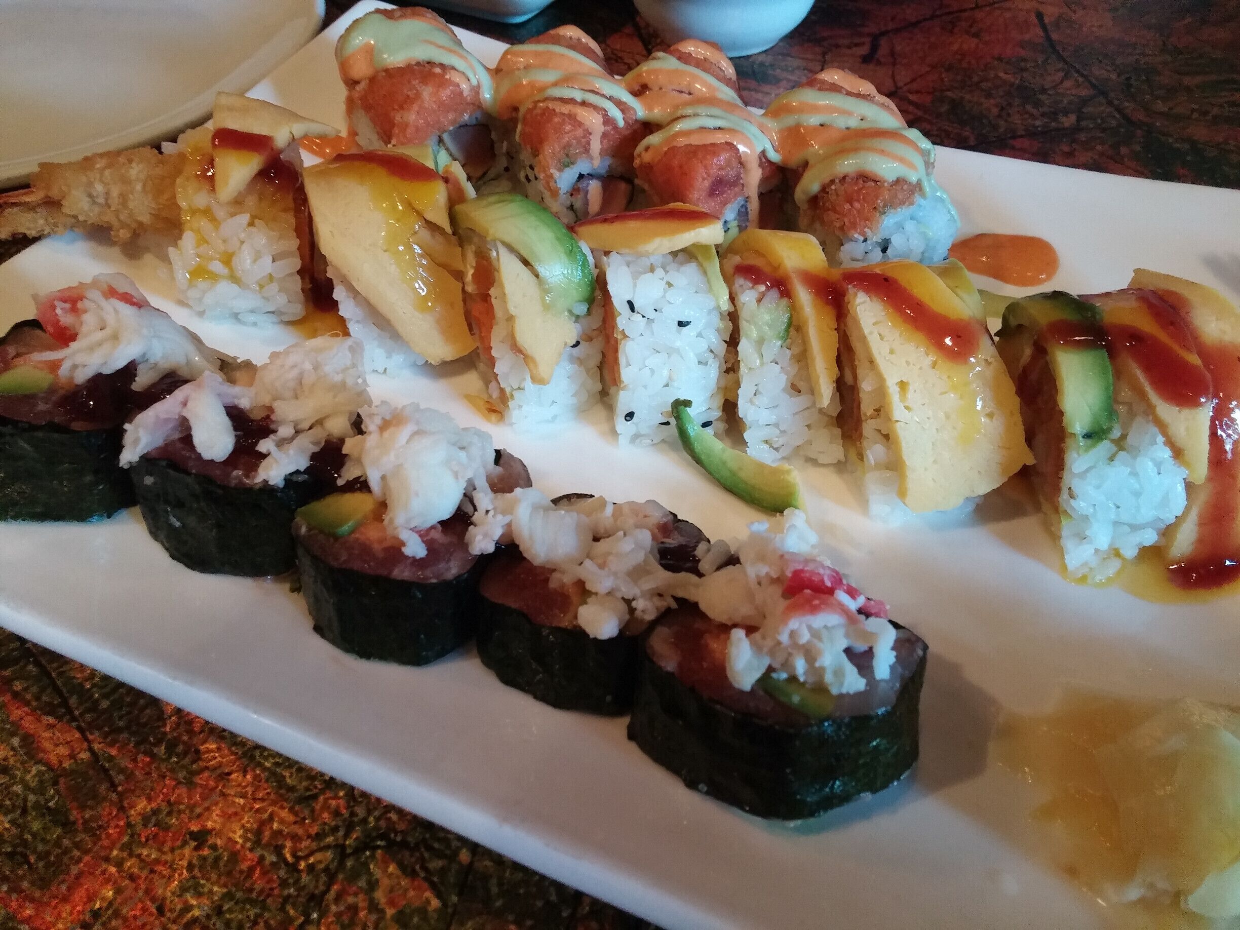 A selection of specialty rolls from Royal Ginger. The winner would have to be the Great Harvest roll with fried sweet potato, cream cheese, tempura shrimp with avocado, sweet egg, and mango pulp.