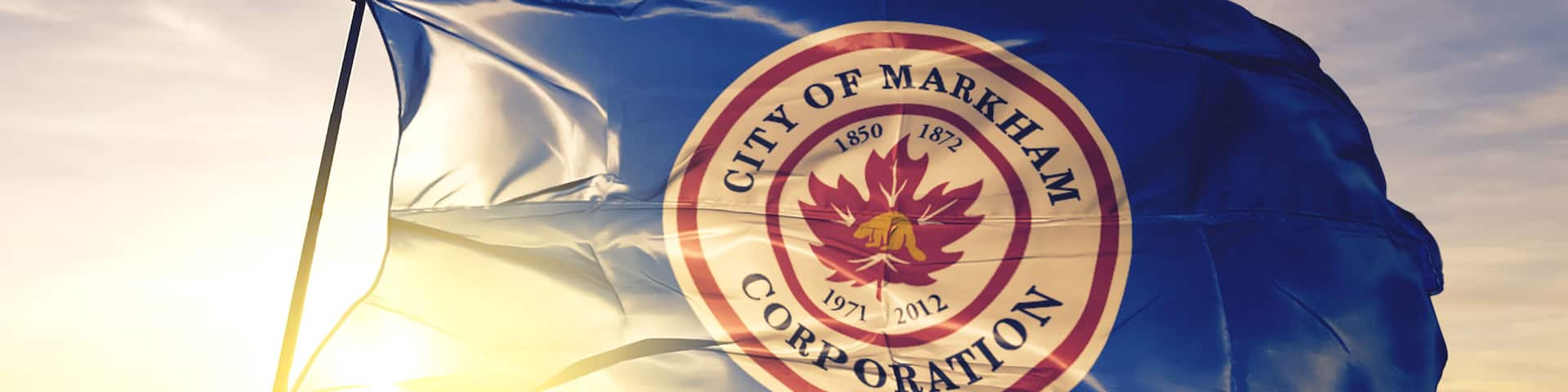 Markham of Ontario of Canada flag waving on the top sunrise mist fog