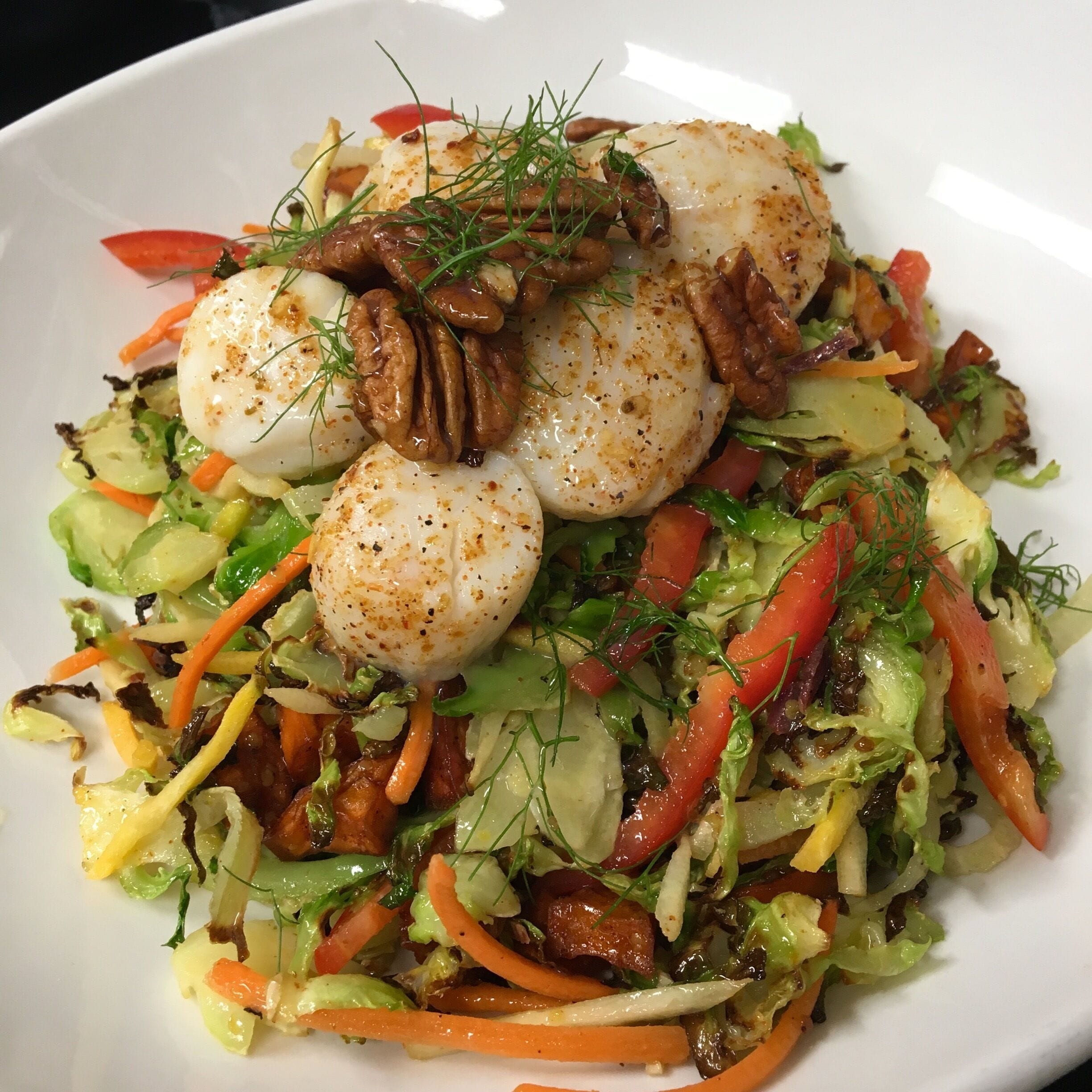 Sea Scallops & Brussel Sprout Salad with a Honey Vinaigrette. Roasted Fennel, Brussel Sprouts & Sweet Potatoes tossed with Red Peppers, Carrots, Goat Cheese, Cajun Pecans and a Honey Vinaigrette topped with seasoned Sea Scallops. #GoodEats