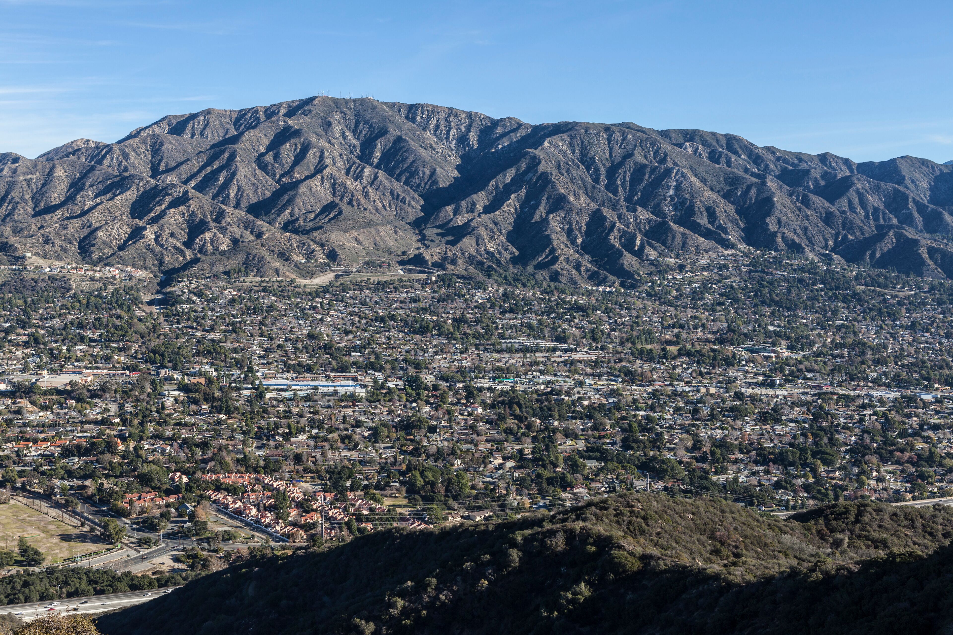 A mountainous landscape with a town nestled in the valley.