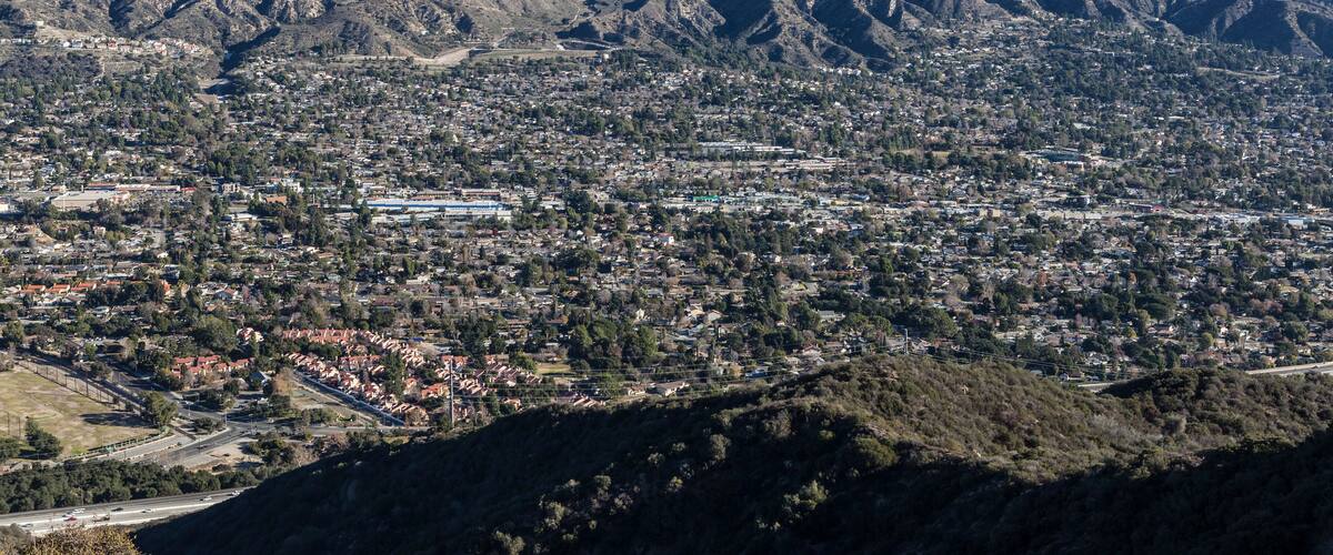 A mountainous landscape with a town nestled in the valley.