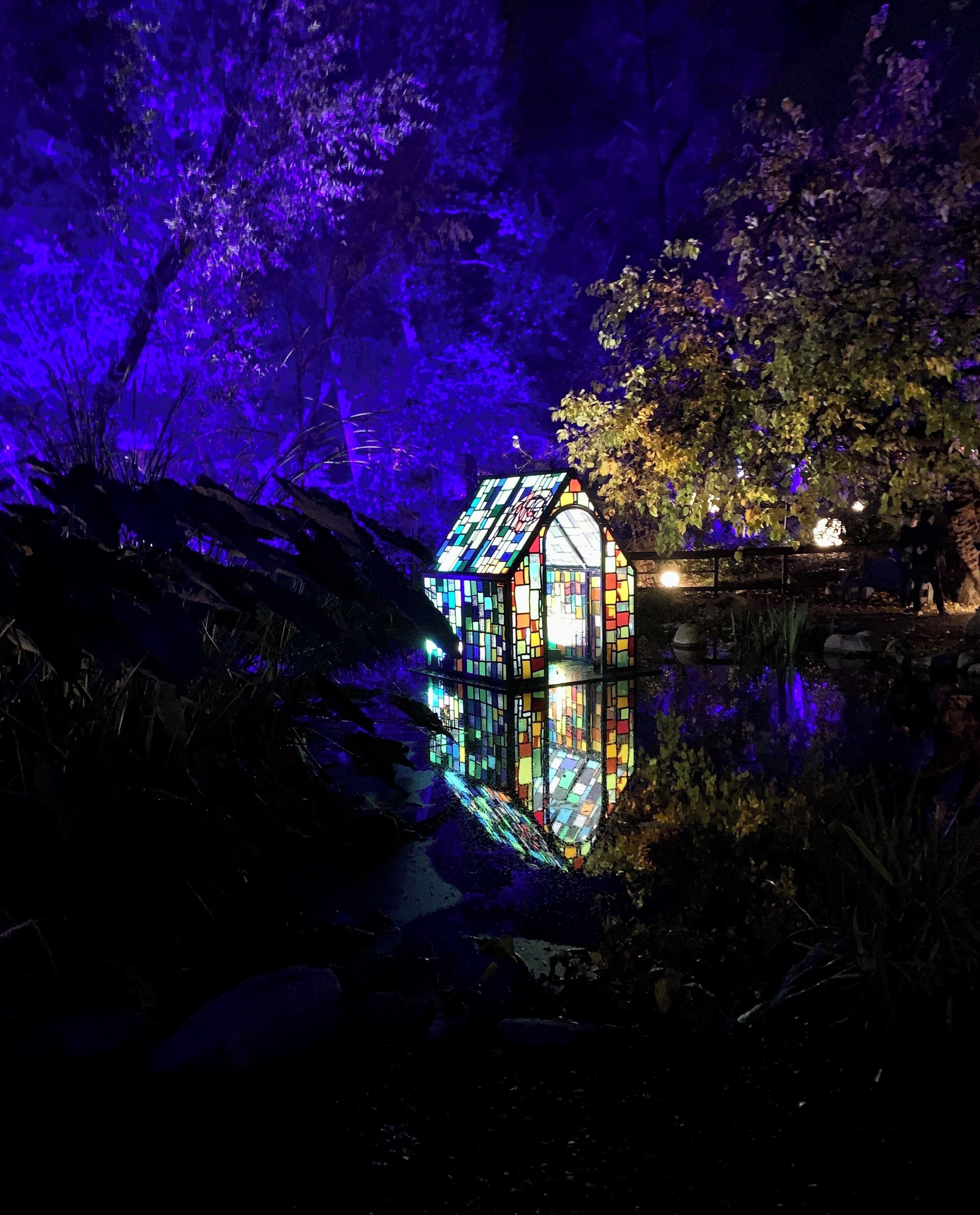 Enchanted Forest. Glass house on a pond.