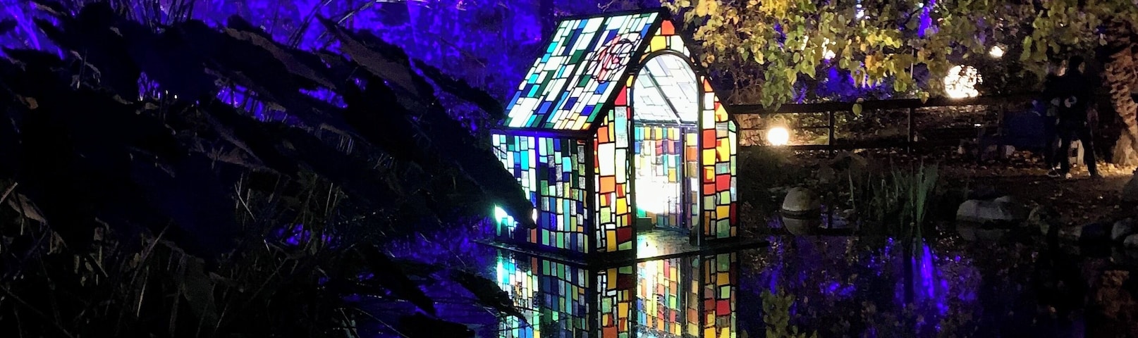 Enchanted Forest. Glass house on a pond.