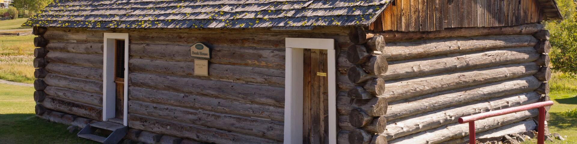 Historic log bunk house at 108 Mile Ranch in BC, Canada