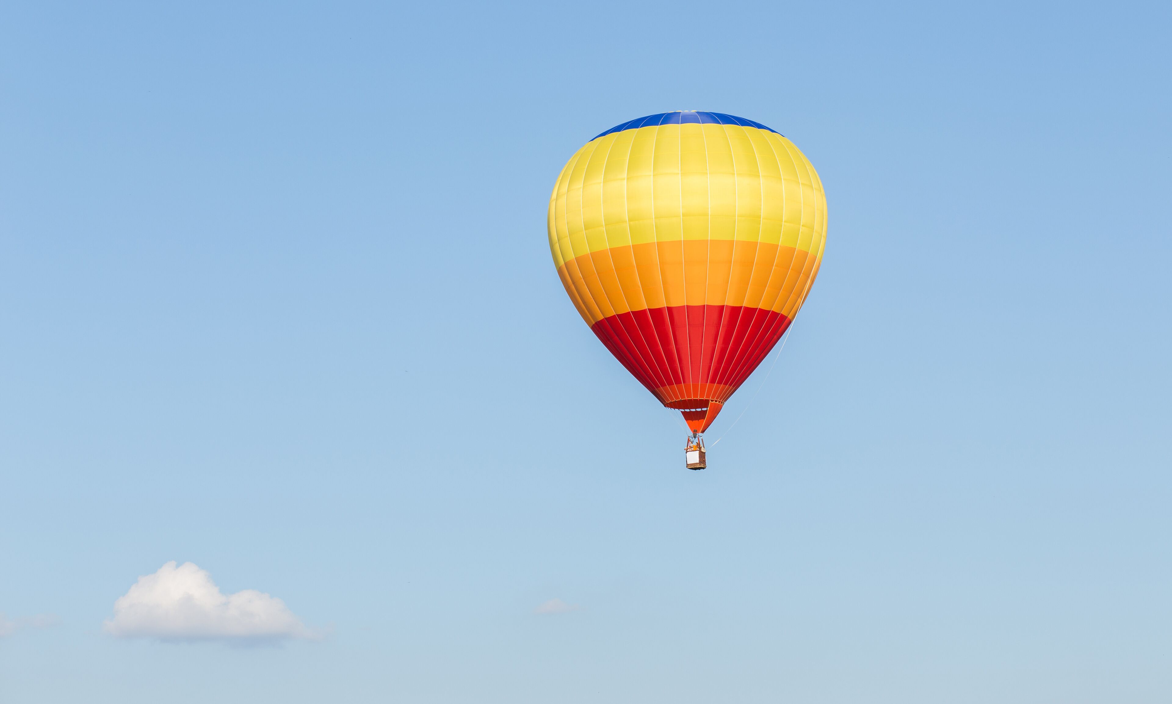 Colorful hot air balloon on blue sky