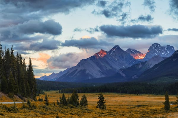 A mountain range with a valley in the foreground.