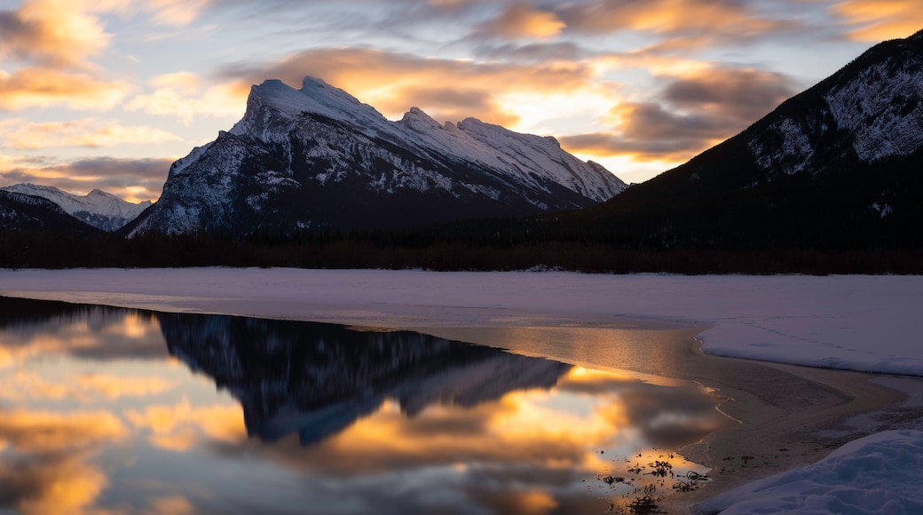 A panoramic view of Vermilion Lakes in Banff National Park during a Winter sunrise.