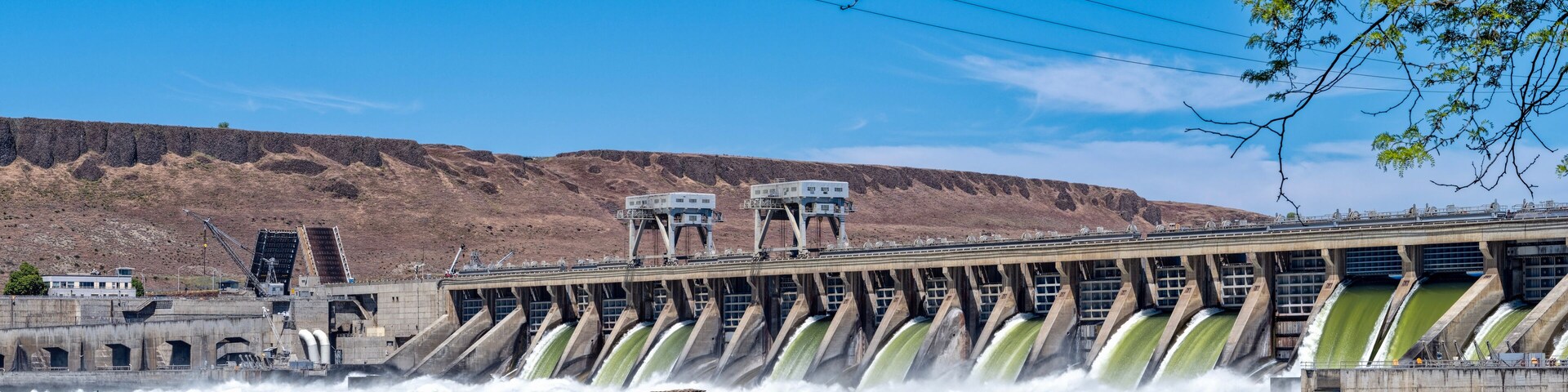 Water flows through the gates of the McNary Dam on the Columbia River at Umatilla, Oregon, USA