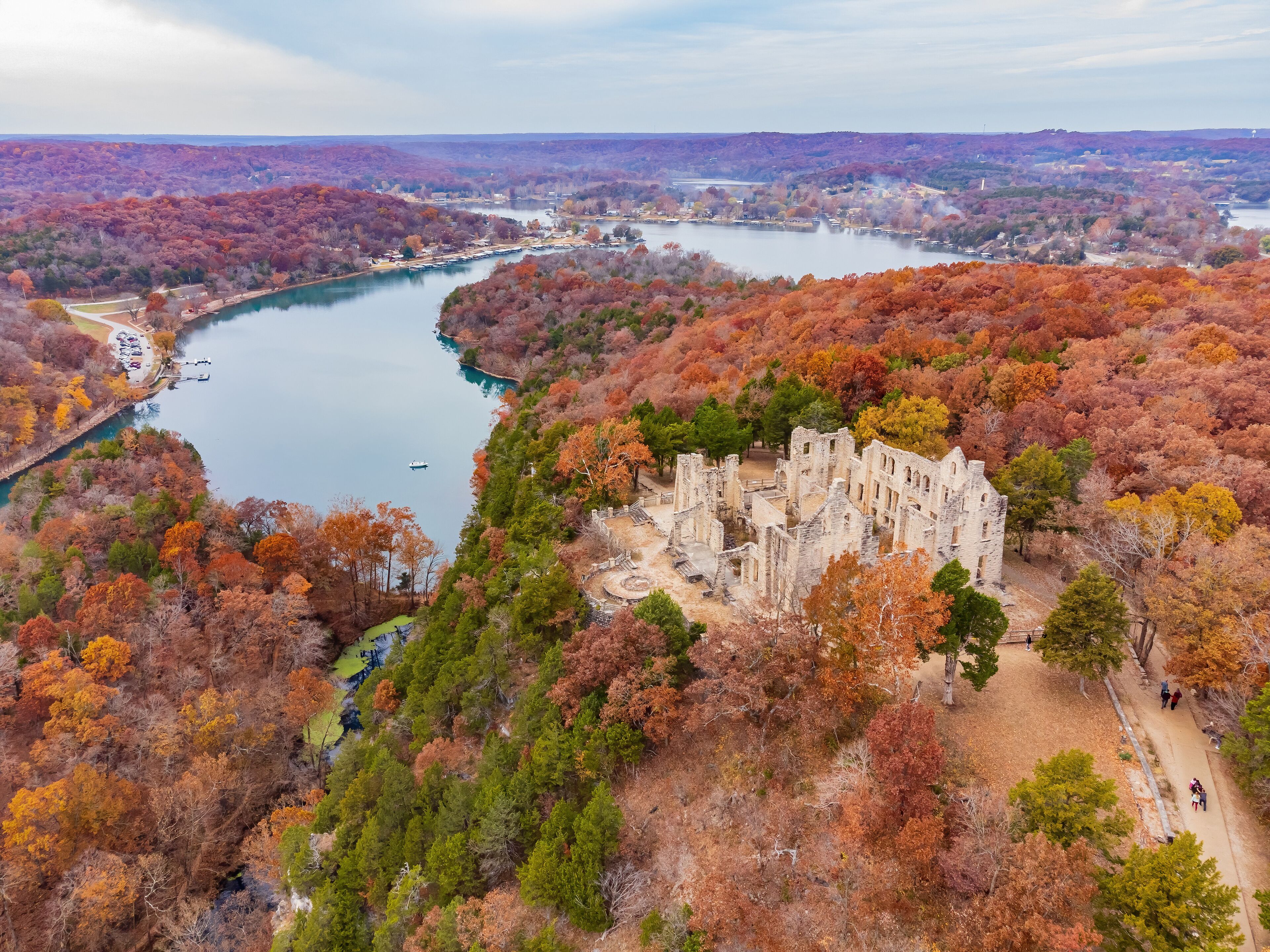 Aerial view of the fall color of Lake Ozark and the castle ruins