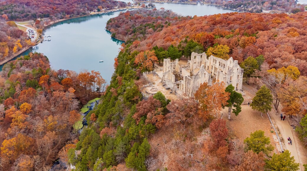 Aerial view of the fall color of Lake Ozark and the castle ruins