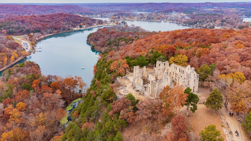 Aerial view of the fall color of Lake Ozark and the castle ruins